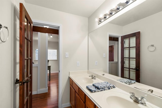 bathroom featuring hardwood / wood-style flooring and vanity