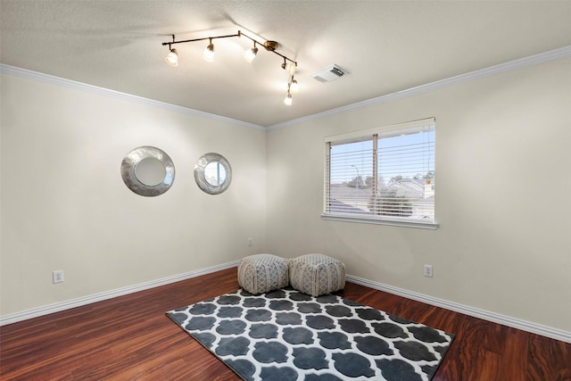 sitting room featuring hardwood / wood-style floors and ornamental molding