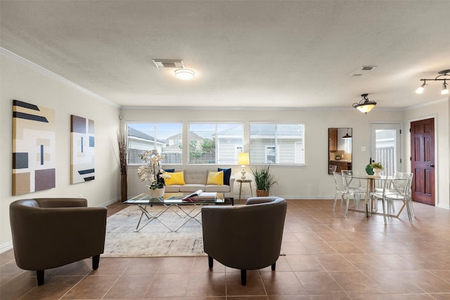 living room with a textured ceiling, tile patterned floors, crown molding, and plenty of natural light