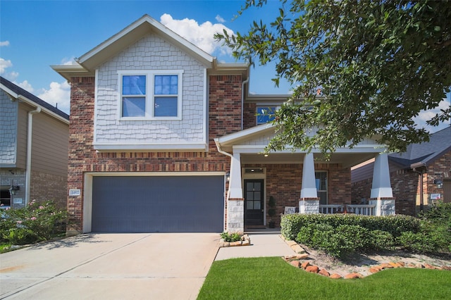 craftsman inspired home with a porch and a garage