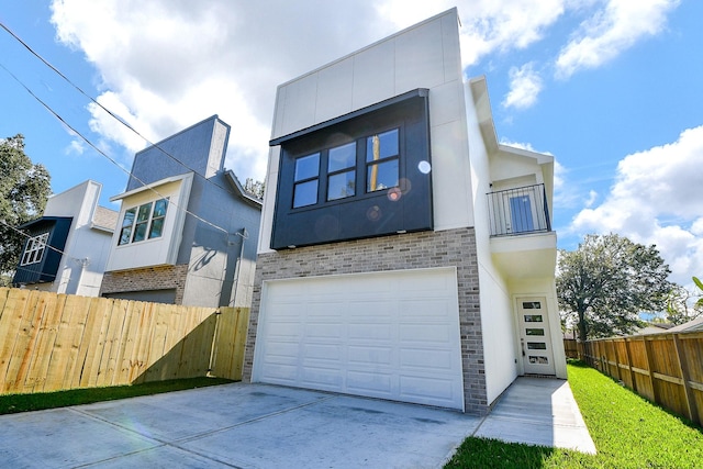 back of house featuring a garage