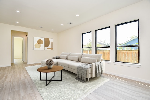 living room with light hardwood / wood-style floors