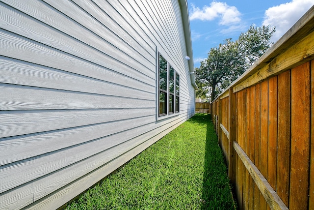 view of home's exterior with a lawn