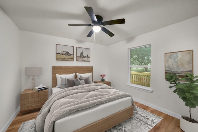 bedroom featuring light wood-type flooring and ceiling fan