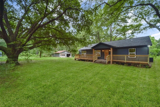 exterior space with an outbuilding and a wooden deck