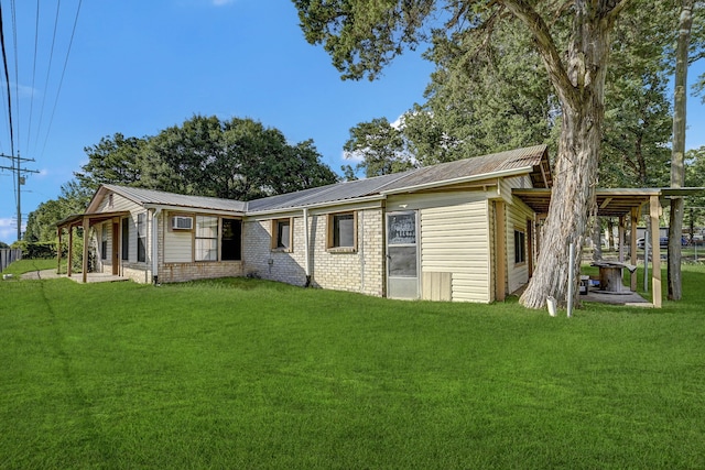 back of house featuring a yard