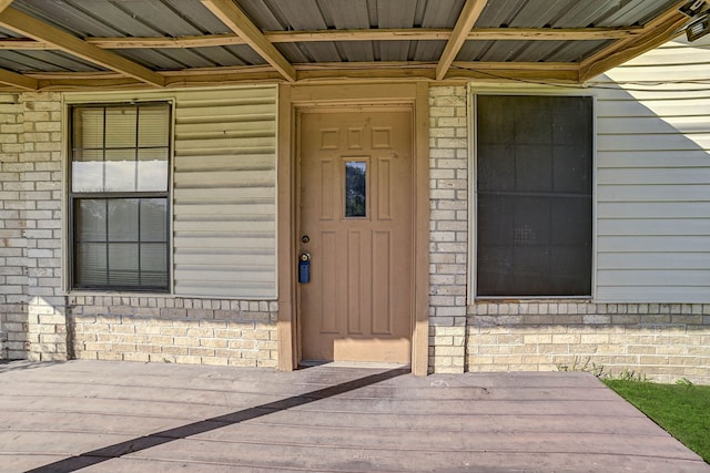 entrance to property featuring a deck