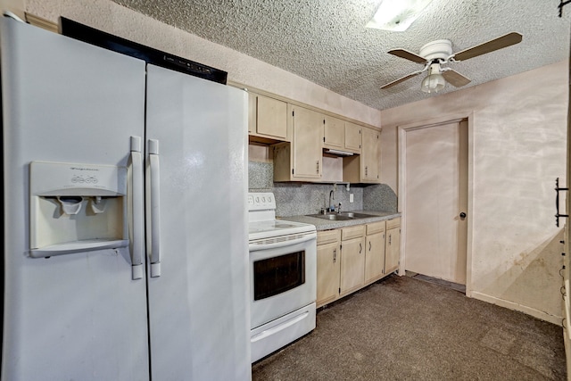 kitchen with white appliances, dark carpet, ceiling fan, sink, and backsplash