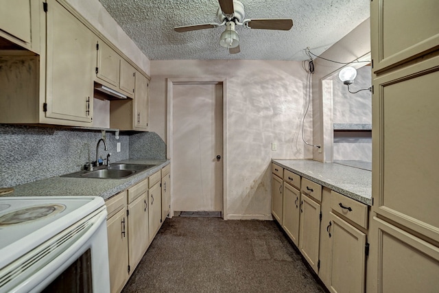 kitchen with cream cabinetry, ceiling fan, a textured ceiling, decorative backsplash, and sink