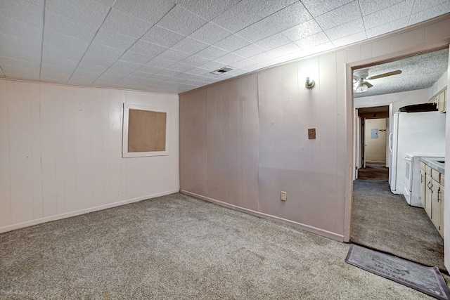 empty room with ceiling fan and light carpet