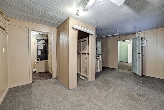 interior space with wooden walls and carpet floors