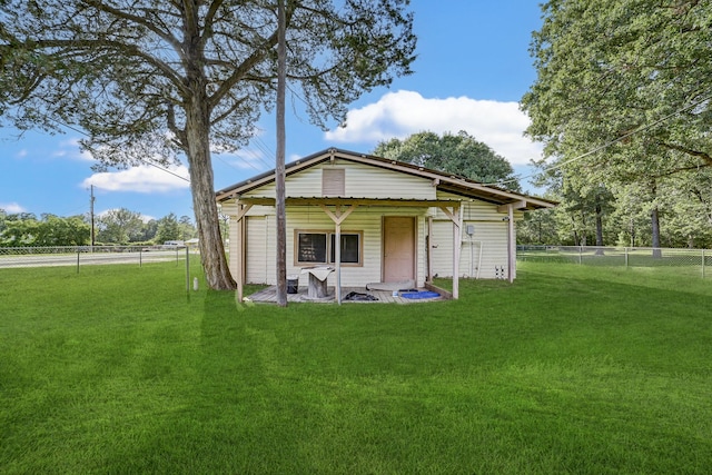 back of house with a yard