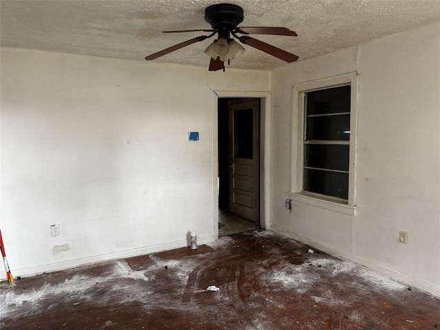 unfurnished room featuring a textured ceiling and ceiling fan