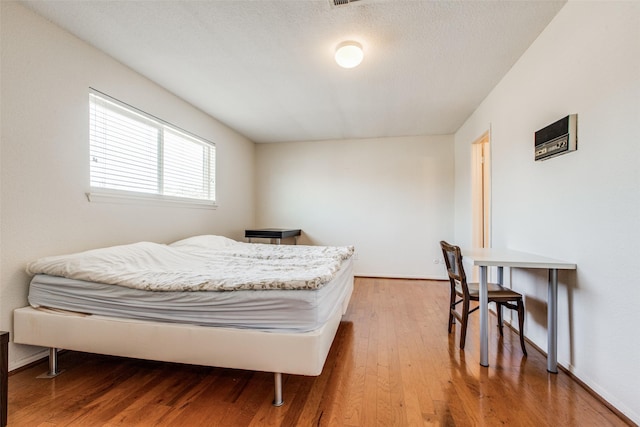 bedroom with wood-type flooring