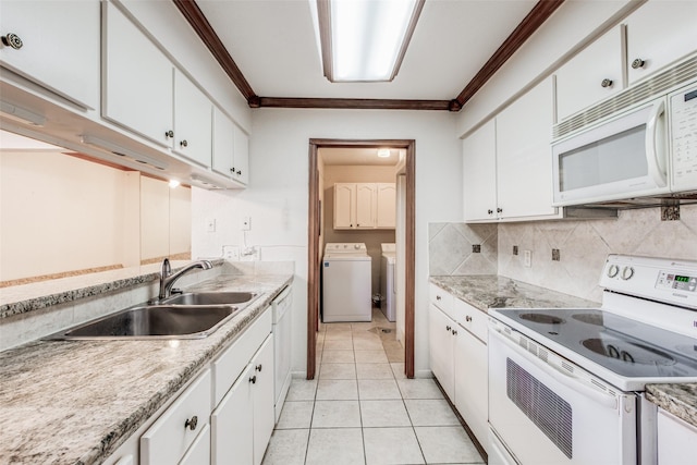 kitchen featuring white appliances, white cabinets, crown molding, and sink