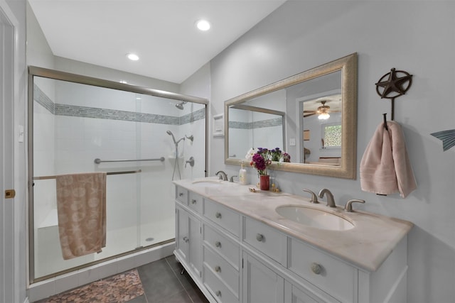 bathroom featuring ceiling fan, walk in shower, tile patterned flooring, and vanity