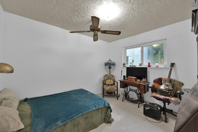 bedroom featuring ceiling fan and a textured ceiling