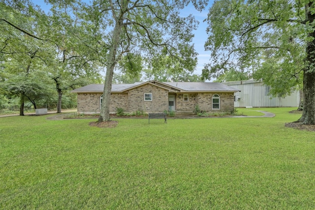 back of house with a lawn