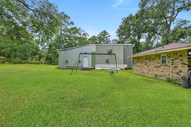 view of outbuilding featuring a lawn