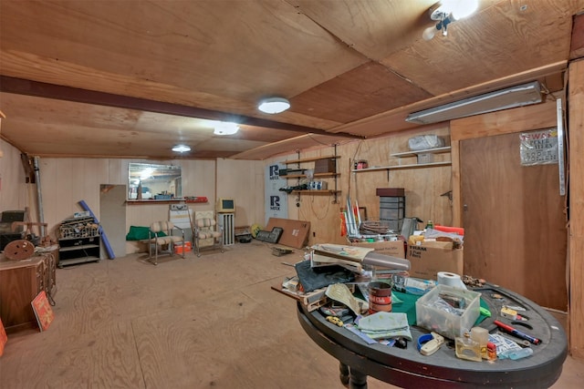 basement featuring wooden walls and wood ceiling