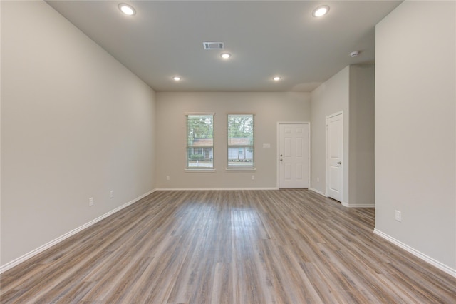 empty room with light hardwood / wood-style floors