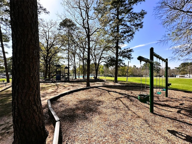 view of property's community with a playground