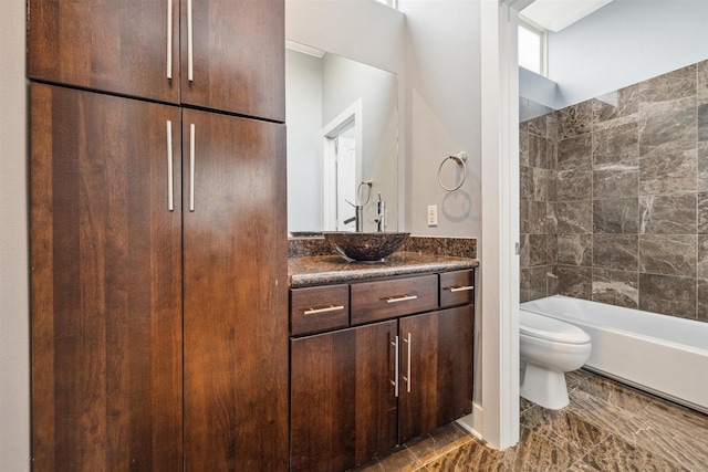 full bathroom featuring toilet, vanity, and bathtub / shower combination