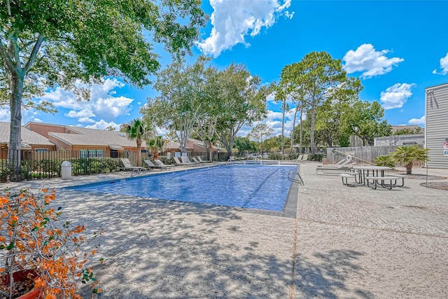 view of swimming pool with a patio