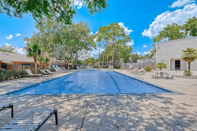 view of swimming pool with a patio area