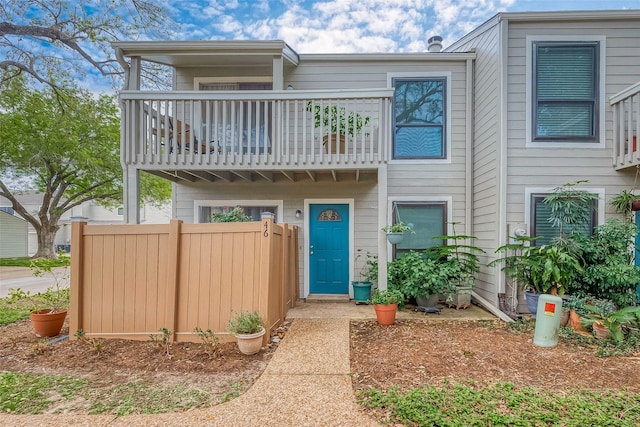 multi unit property featuring a balcony