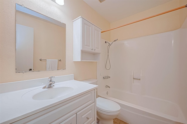 full bathroom featuring toilet, vanity, and bathing tub / shower combination