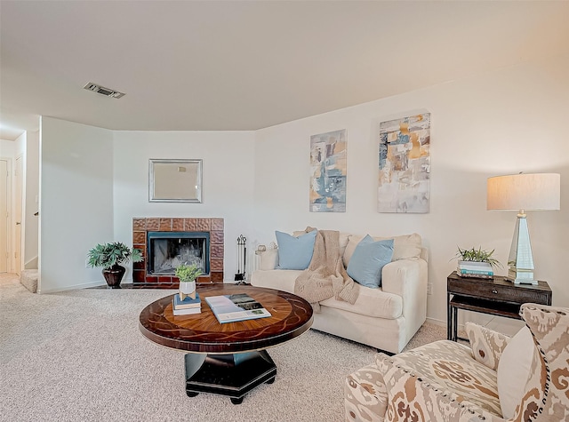 carpeted living room featuring a fireplace