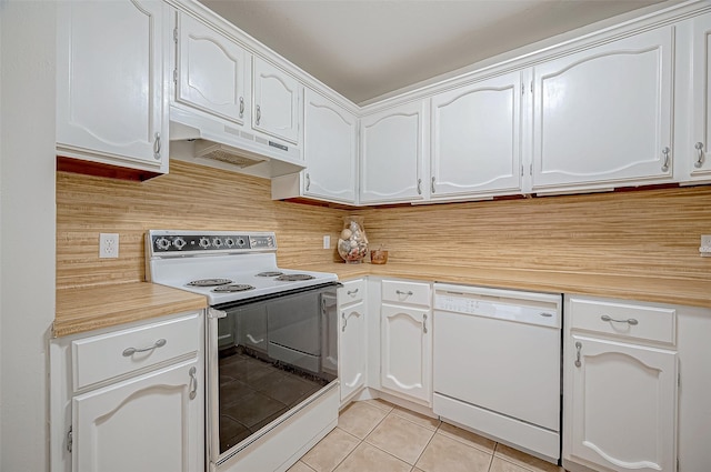 kitchen featuring white appliances, white cabinetry, and light tile patterned floors