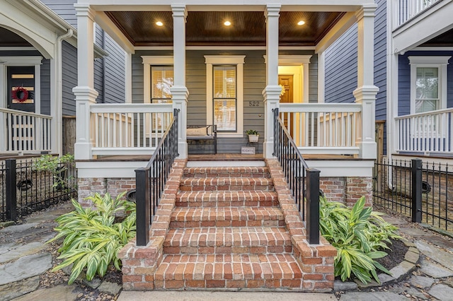 doorway to property featuring covered porch