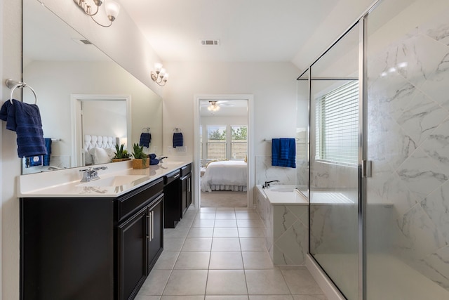 bathroom featuring vanity, independent shower and bath, tile patterned floors, and ceiling fan with notable chandelier