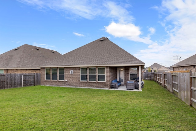 rear view of property with a lawn, an outdoor hangout area, and a patio area