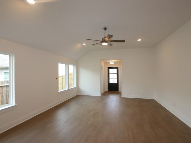 597 Copper Springs Dr, Magnolia, TX 77354 - spare room featuring ceiling fan, dark wood-style flooring, baseboards, vaulted ceiling, and recessed lighting