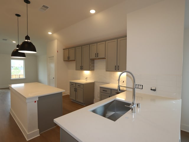 597 Copper Springs Dr, Magnolia, TX 77354 - kitchen featuring a sink, gray cabinetry, dark wood finished floors, and recessed lighting