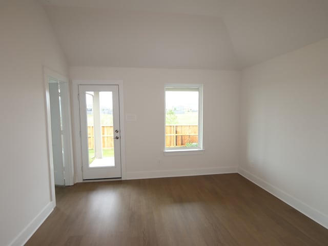 597 Copper Springs Dr, Magnolia, TX 77354 - spare room with vaulted ceiling, baseboards, and dark wood-type flooring