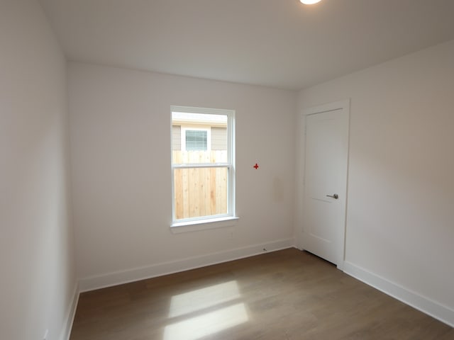 597 Copper Springs Dr, Magnolia, TX 77354 - empty room with wood finished floors and baseboards