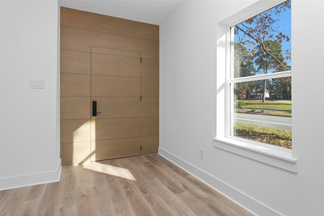 spare room with light hardwood / wood-style floors