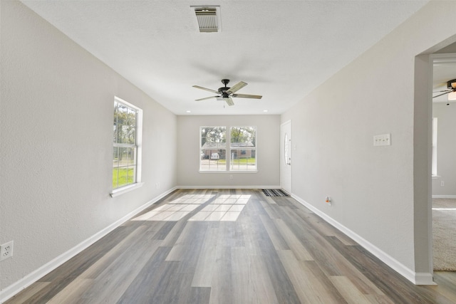 unfurnished room featuring wood-type flooring and ceiling fan