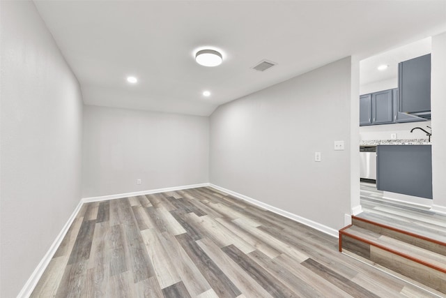 unfurnished room featuring light hardwood / wood-style floors