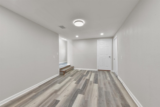 unfurnished room with light hardwood / wood-style floors