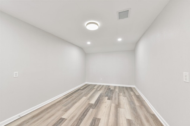 unfurnished room with light wood-type flooring