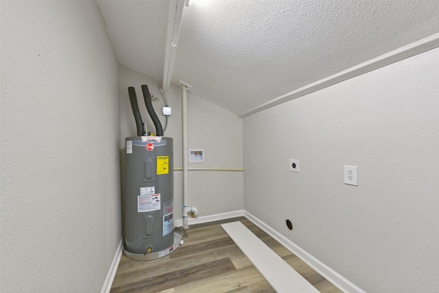 utility room featuring water heater