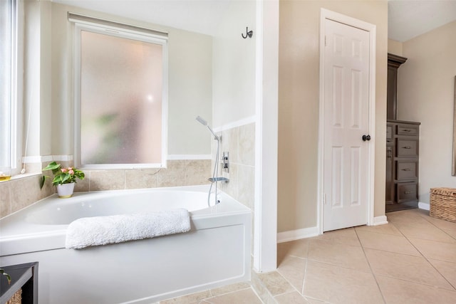 bathroom with tile patterned floors and a washtub