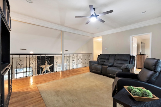 living room with ornamental molding, ceiling fan, and wood-type flooring