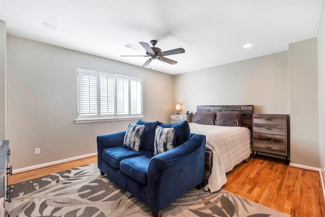 bedroom featuring hardwood / wood-style flooring and ceiling fan