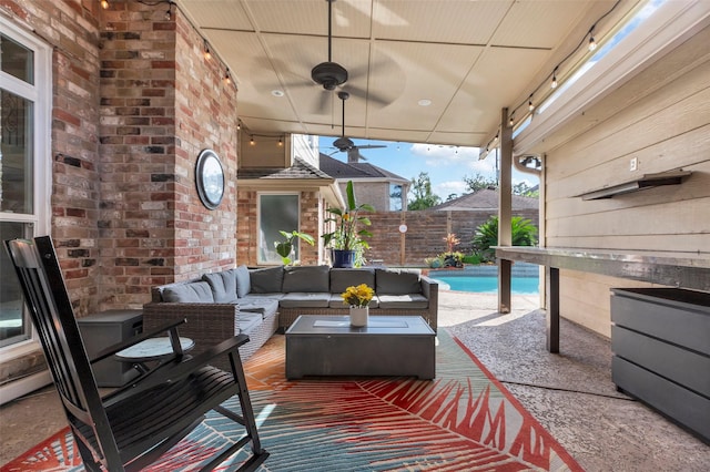 view of patio with ceiling fan, an outdoor hangout area, and a fenced in pool